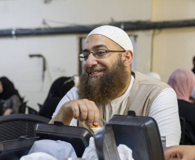 Black-and-white portrait of Sheikh Mohammad Elshinawy, scholar, smiling